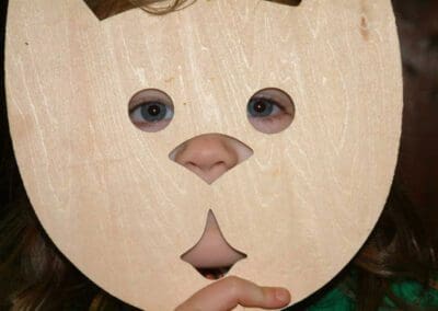 a child with a cat mask